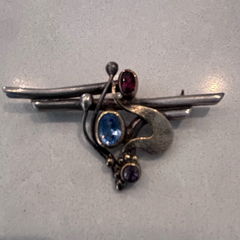 Elegant Silver and Gold Brooch with Gem Accents